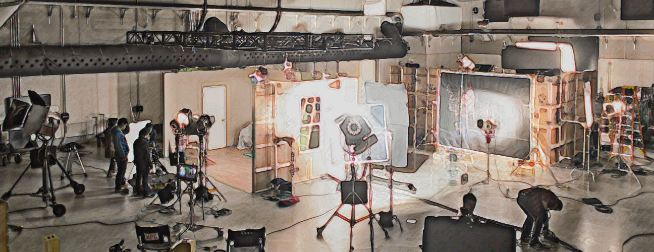 inside film studio in film school, teaching a lighting workshop on set
